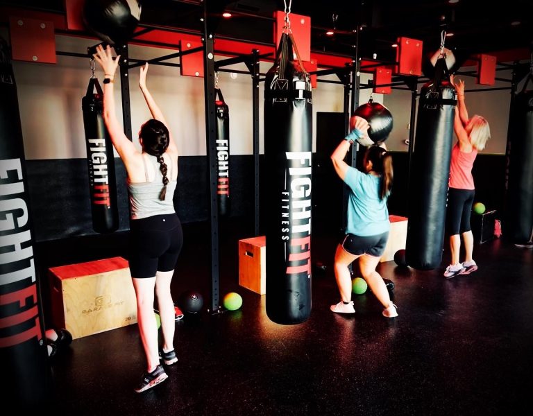 Empowered women sweating it out at FightFit Fitness Rock Hills top kickboxing fitness destination 768x600