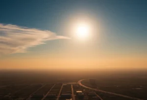 A cityscape under a blazing sun depicting a heat wave