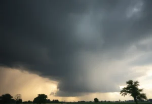 Dark thunderclouds looming over a rural area signaling severe weather