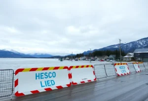 Flooded streets in Juneau, Alaska with Hesco barriers protecting homes