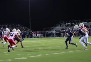 Rock Hill high school football players in action on the field during a game.