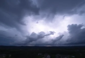 Cloudy sky with thunderstorm clouds and lightning above Greenville and Spartanburg.
