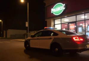 Police car outside a business at night in Newberry Township